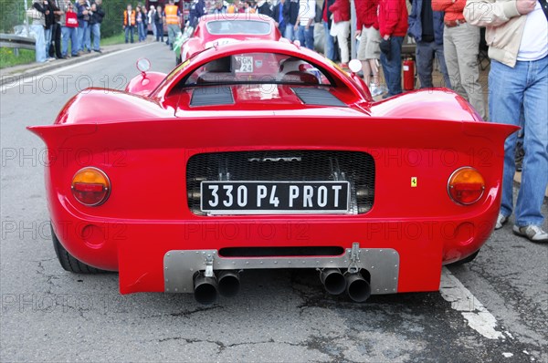 Rear view of a red super sports car on a race track with spectators, SOLITUDE REVIVAL 2011, Stuttgart, Baden-Wuerttemberg, Germany, Europe