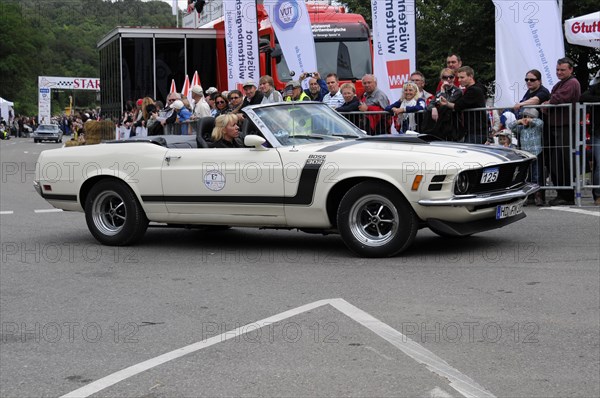Beige Ford Mustang convertible driving at a classic car event, surrounded by spectators, SOLITUDE REVIVAL 2011, Stuttgart, Baden-Wuerttemberg, Germany, Europe