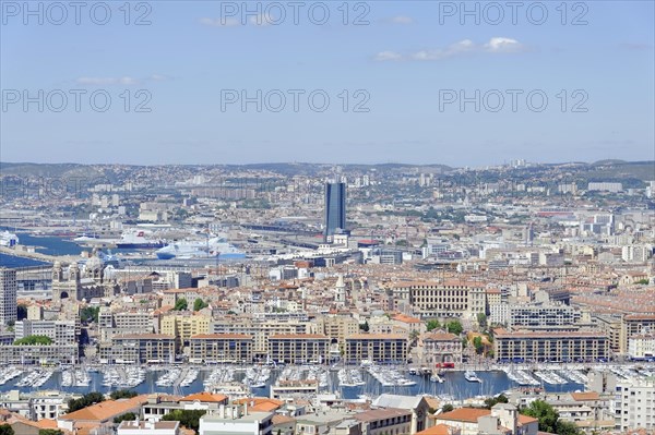 Aerial view of the harbour of Marseille, surrounded by urban development and the sea, Marseille, Departement Bouches-du-Rhone, Region Provence-Alpes-Cote d'Azur, France, Europe