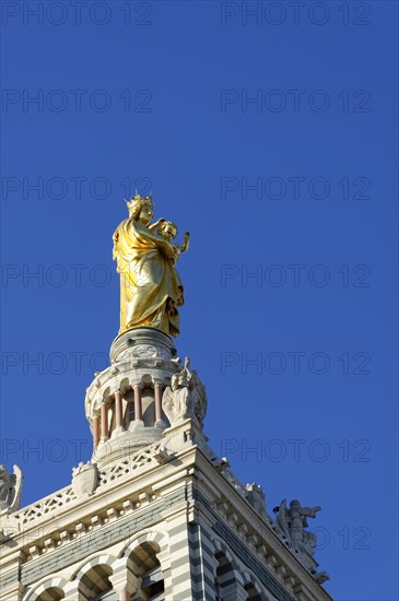 Church of Notre-Dame de la Garde, Marseille, Golden religious statue on a cathedral in front of a blue sky, Marseille, Departement Bouches-du-Rhone, Region Provence-Alpes-Cote d'Azur, France, Europe