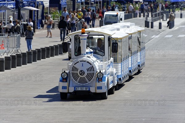 Marseille, Blue and white tourist train travelling on a promenade, Marseille, Departement Bouches-du-Rhone, Region Provence-Alpes-Cote d'Azur, France, Europe