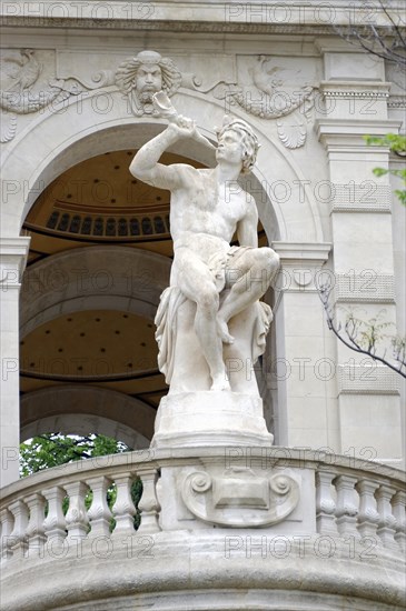 Palais Longchamp, Marseille, A marble statue of a boy holding a winged creature on a building, Marseille, Departement Bouches-du-Rhone, Region Provence-Alpes-Cote d'Azur, France, Europe