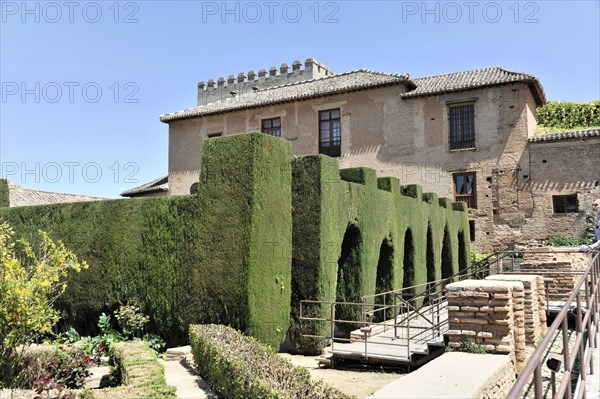 Patio de Machuca, Alhambra, Granada, Historic building surrounded by carefully trimmed hedges on a sunny day, Granada, Andalusia, Spain, Europe