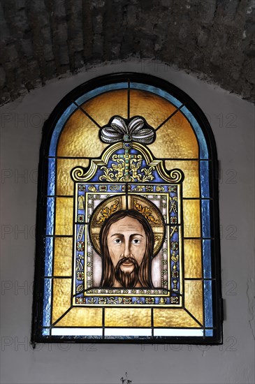 Castillo de Santa Catalina in Jaen, artistic stained glass window with a portrait of Jesus, Granada, Andalusia, Spain, Europe