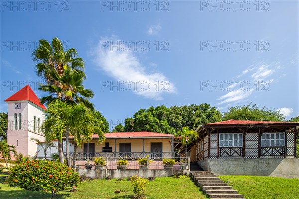 Deshaies, historic Caribbean wooden building of a street in Guadeloupe, Caribbean, French Antilles