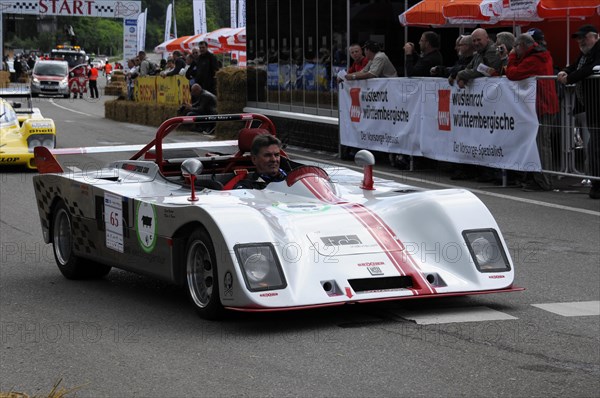 A white and red open-top racing car on a race track, driver in a red helmet, SOLITUDE REVIVAL 2011, Stuttgart, Baden-Wuerttemberg, Germany, Europe