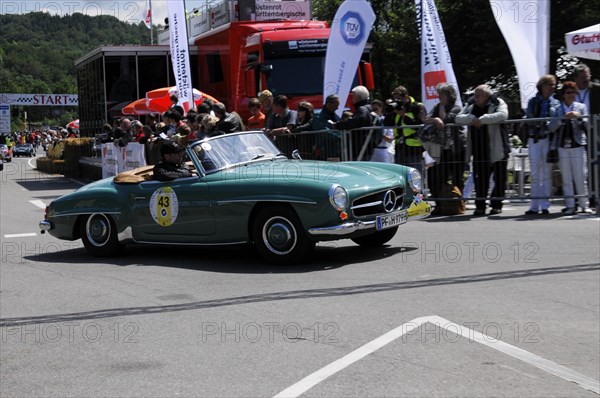 Green Mercedes vintage convertible waiting at the starting line, surrounded by motorsport fans, SOLITUDE REVIVAL 2011, Stuttgart, Baden-Wuerttemberg, Germany, Europe