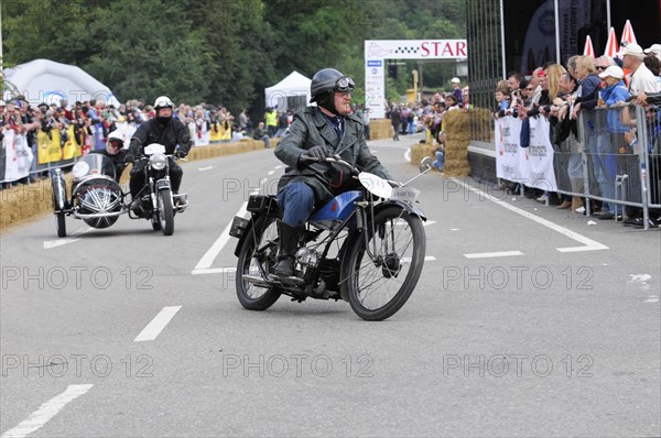 Historic motorbike in racing mode in front of a crowd of spectators, SOLITUDE REVIVAL 2011, Stuttgart, Baden-Wuerttemberg, Germany, Europe