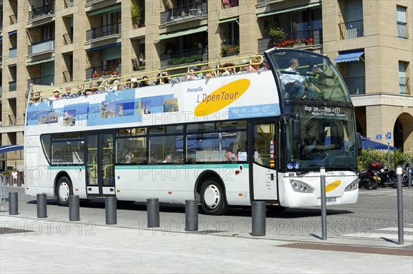 Marseille harbour, tourist bus in city traffic with passengers on board, Marseille, Departement Bouches-du-Rhone, Provence-Alpes-Cote d'Azur region, France, Europe