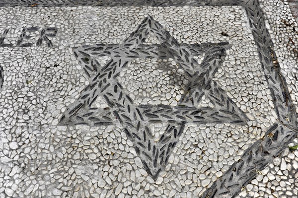 Solabrena, Creative star mosaic design embedded in a pebble pavement, Costa del Sol, Andalusia, Spain, Europe