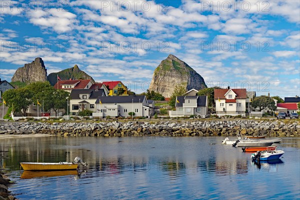 Small harbour and high mountains on the island of Traena, Lovunden, Helgeland coast, Norway, Europe