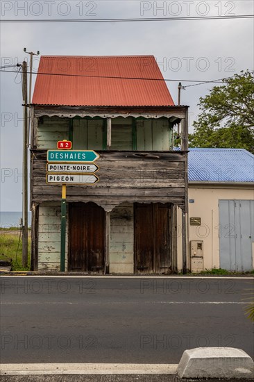 Deshaies, historic Caribbean wooden building of a street in Guadeloupe, Caribbean, French Antilles