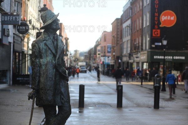 A statue to James Joyce, the famous Irish writer and creator of the book Ulysses, by artist Marjorie Fitzgibbon on a grey day. Dublin, Ireland, Europe