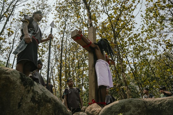 Christian devotees takes part in a perform to re-enactment of the crucifixion of Jesus Christ during a procession on Good Friday, on March 29, 2024 in Guwahati, Assam, India. Good Friday is a Christian holiday commemorating the crucifixion of Jesus Christ and his death at Calvary