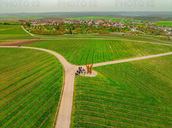 People standing at a fork in a vineyard with a village in the distance, Jesus Grace Chruch, Weitblickweg, Easter hike, Hohenhaslach, Germany, Europe