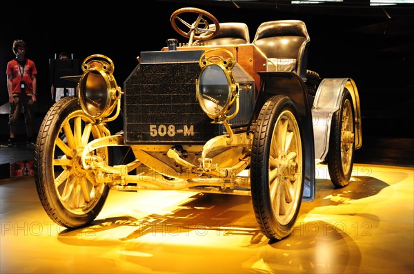 Vintage vehicle presented at an exhibition with warm light, Mercedes-Benz Museum, Stuttgart, Baden-Wuerttemberg, Germany, Europe