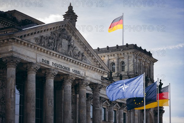 The flag of NATO, Europe and the Federal Republic of Germany photographed at the Reichstag building in Berlin, 04/04/2024