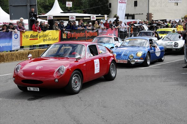 Red and blue classic sports cars on the racetrack, surrounded by spectators, SOLITUDE REVIVAL 2011, Stuttgart, Baden-Wuerttemberg, Germany, Europe