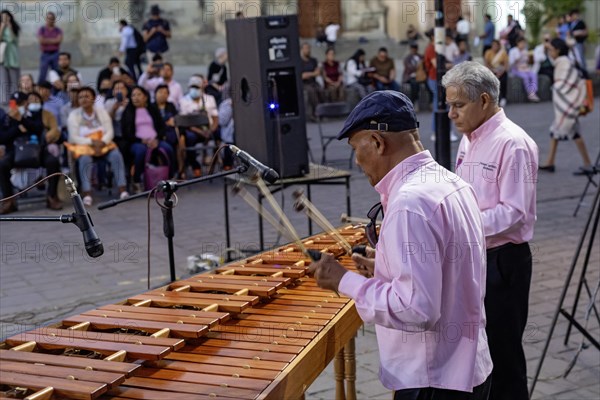 Oaxaca, Mexico, The Marimba del Estado band entertains a crowd in the zocalo. Marimba band music is traditional in southern Mexico, Central America