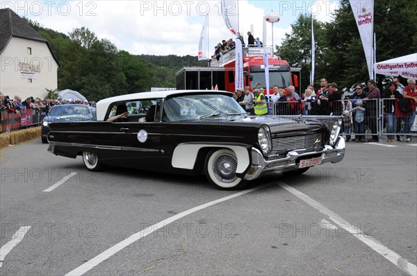 Black and white luxury convertible classic car in front of a group of spectators, SOLITUDE REVIVAL 2011, Stuttgart, Baden-Wuerttemberg, Germany, Europe