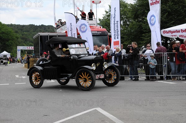 A black Ford Model T vintage car drives in front of spectators at a historic car race, SOLITUDE REVIVAL 2011, Stuttgart, Baden-Wuerttemberg, Germany, Europe