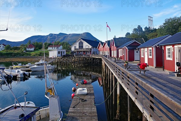 Wooden jetty with cosy wooden houses, fishing boats and benches, Rorbuer, holiday, fishing, Halsa, Kystriksveien, FV 17, Norway, Europe