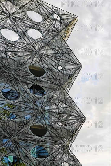 Reutlingen University, Reutlingen University, Texoversum, German University Building Award 2024 for TEXOVERSUM, modern architecture, facade made of carbon and glass fibres, mesh, innovative, identity-creating, unique facade, campus, place of learning, special, extraordinary new building for textile courses, light, airy, airy, holes, architectural eye-catcher, cloudy sky, Reutlingen, Baden-Wuerttemberg, Germany, Europe