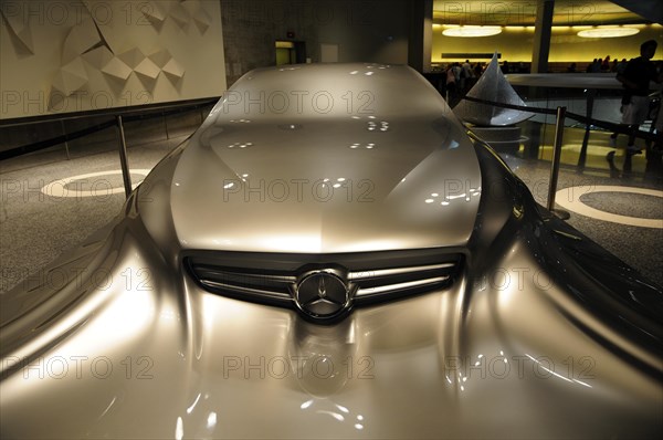 Futuristic concept car from Mercedes-Benz with glossy surface and strong lighting, Mercedes-Benz Museum, Stuttgart, Baden-Wuerttemberg, Germany, Europe