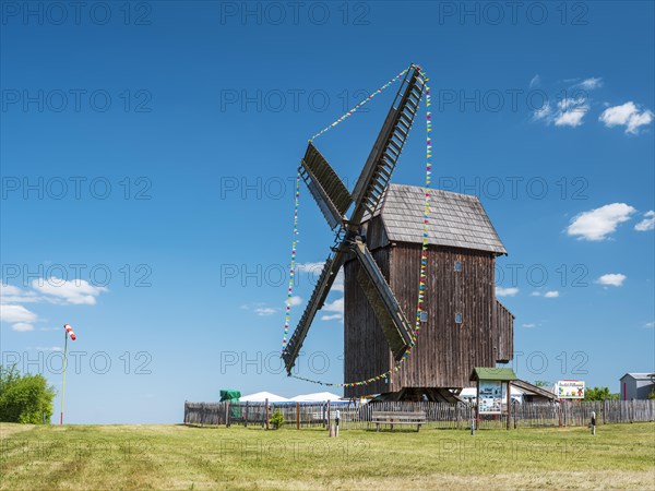 Zwochau mill, trestle windmill, windmill decorated with pennants for Mill Day, Zwochau, Saxony, Germany, Europe