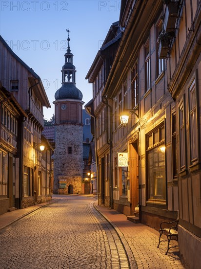 Niedergasse with Saigerturm at dusk, half-timbered houses and cobblestones, Stolberg im Harz, Saxony-Anhalt, Germany, Europe