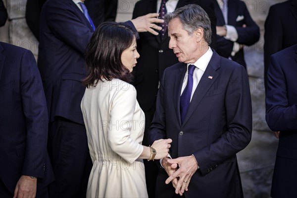 (L-R) Annalena Baerbock, Federal Foreign Minister, in conversation with Antony Blinken, Secretary of State of the United States of America, at the family photo during the meeting of NATO foreign ministers. Brussels, 03.04.2024. Photographed on behalf of the Federal Foreign Office
