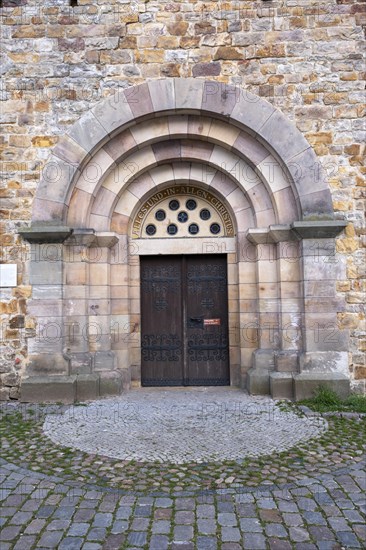 Slogan All and in all Christ above a door of St Mary's Cathedral, Havelberg, Saxony-Anhalt, Germany, Europe