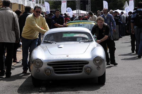 People pushing a classic silver sports car at a racing event, SOLITUDE REVIVAL 2011, Stuttgart, Baden-Wuerttemberg, Germany, Europe