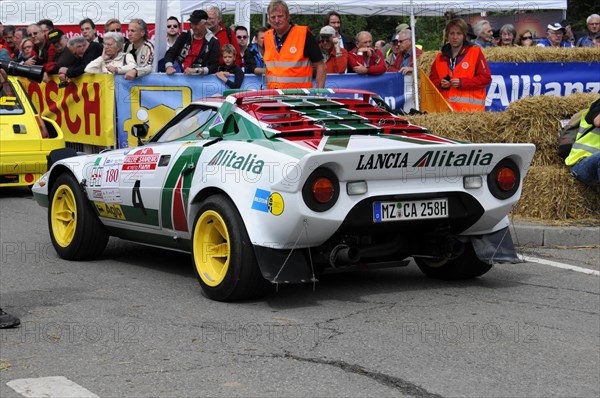 Rear view of a Lancia Stratos rally car surrounded by spectators at a race, SOLITUDE REVIVAL 2011, Stuttgart, Baden-Wuerttemberg, Germany, Europe
