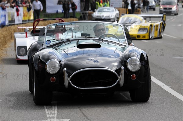 A black classic convertible racing car on a race track in front of spectators, SOLITUDE REVIVAL 2011, Stuttgart, Baden-Wuerttemberg, Germany, Europe