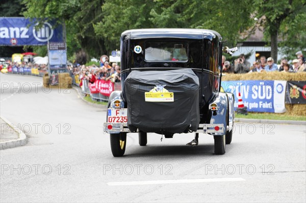Ford Model A, year of construction 1929, A black vintage car drives on a street at an event, surrounded by spectators, SOLITUDE REVIVAL 2011, Stuttgart, Baden-Wuerttemberg, Germany, Europe