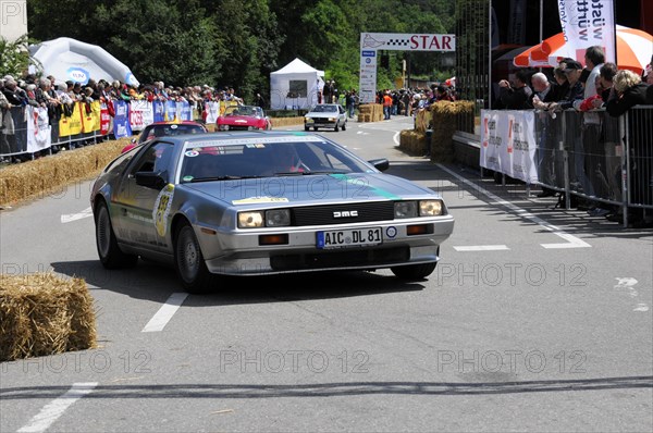 A silver DeLorean drives on a road during a classic car race, SOLITUDE REVIVAL 2011, Stuttgart, Baden-Wuerttemberg, Germany, Europe
