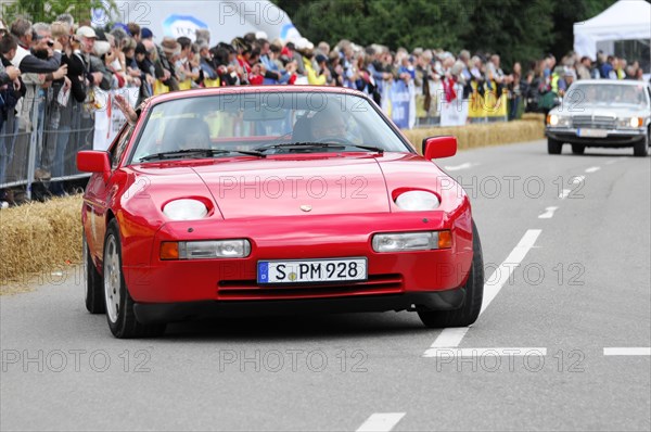 A red Porsch sports car with a modern design takes part in a classic car race, SOLITUDE REVIVAL 2011, Stuttgart, Baden-Wuerttemberg, Germany, Europe