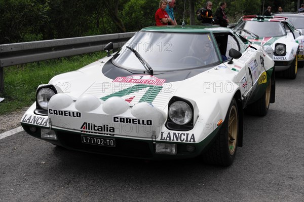 A white Lancia Stratos racing car with green stripes and red accents ready for a rally, SOLITUDE REVIVAL 2011, Stuttgart, Baden-Wuerttemberg, Germany, Europe