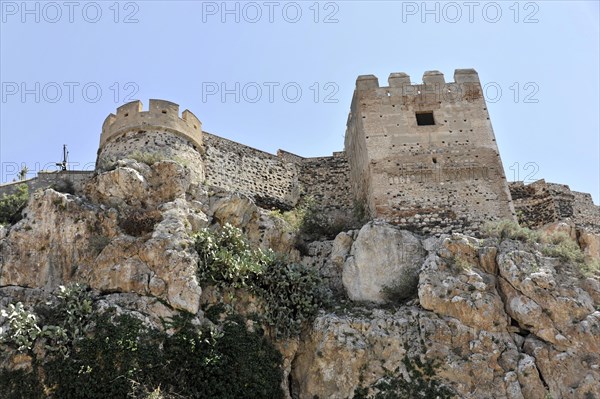 Solabrena, Old castle fortress on a rock with battlements and towers, signs of ruin and decay, Costa del Sol, Andalusia, Spain, Europe