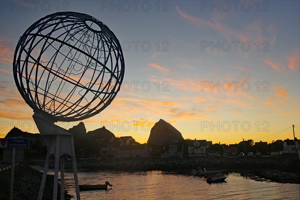 Large globe and small harbour in the evening light, Lovunden, Helgeland coast, Traena, Norway, Europe