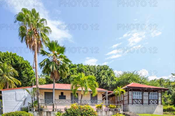 Deshaies, historic Caribbean wooden building of a street in Guadeloupe, Caribbean, French Antilles