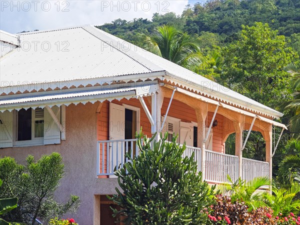 Deshaies, historic Caribbean wooden building of a street in Guadeloupe, Caribbean, French Antilles