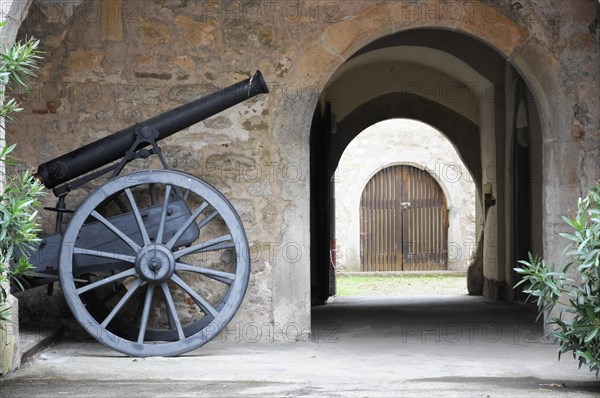 Langenburg Castle, An old cannon in front of a passageway in a historic building, Langenburg Castle, Langenburg, Baden-Wuerttemberg, Germany, Europe