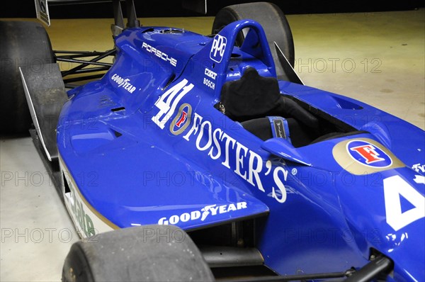 Deutsches Automuseum Langenburg, A blue Formula 1 car with Porsche and Foster's advertising in an exhibition centre, Deutsches Automuseum Langenburg, Langenburg, Baden-Wuerttemberg, Germany, Europe