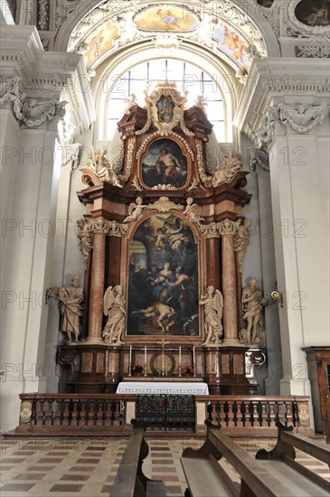 St Stephen's Cathedral, Passau, Detailed altar with painting surrounded by sculptures and gold-decorated columns, Passau, Bavaria, Germany, Europe