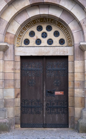 Slogan All and in all Christ above a door of St Mary's Cathedral, Havelberg, Saxony-Anhalt, Germany, Europe