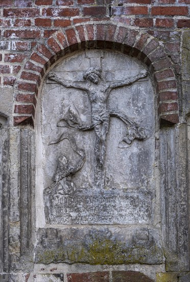 Stone relief of the crucified Christ at St Mary's Cathedral, Havelberg, Saxony-Anhalt, Germany, Europe