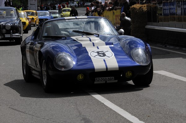Blue racing car with white stripe and start number driving in front of spectators on a street, SOLITUDE REVIVAL 2011, Stuttgart, Baden-Wuerttemberg, Germany, Europe