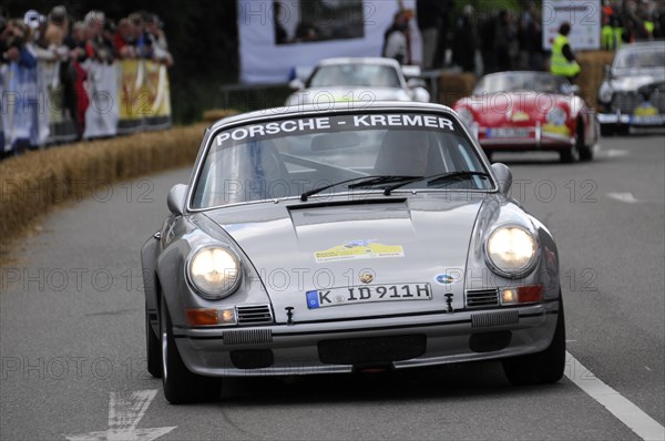 A white classic Porsche drives past spectators at a race track, SOLITUDE REVIVAL 2011, Stuttgart, Baden-Wuerttemberg, Germany, Europe